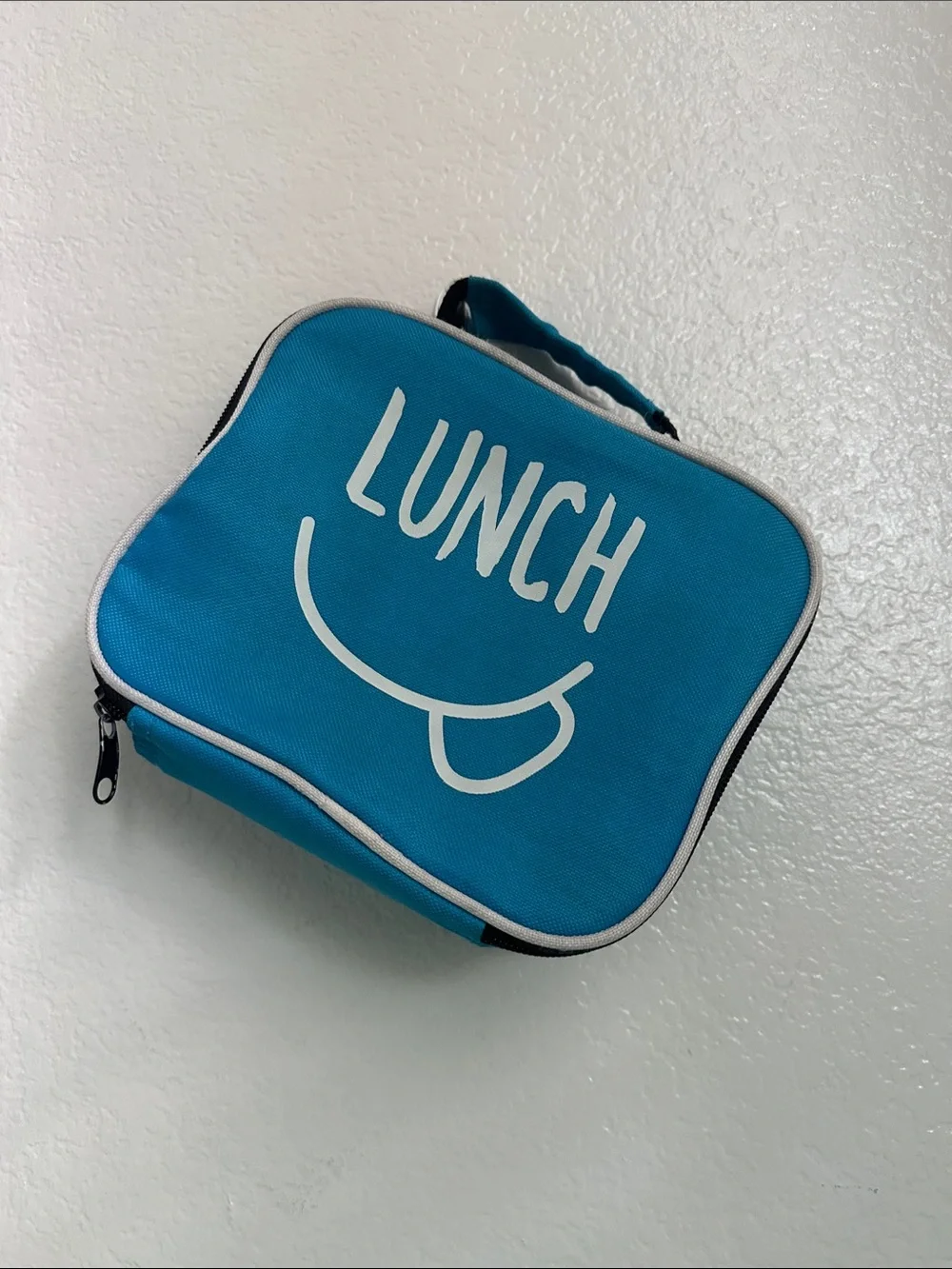 Walmart blue insulated lunch box with a minimalist white ’LUNCH’ graphic-used